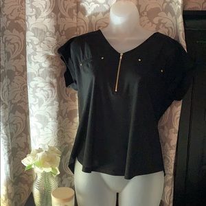Black blouse with gold zipper in chest area